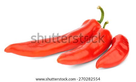  Three red sweet peppers of different size isolated on white background.