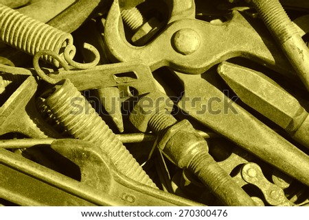 dirty and broken tools in a box, closeup of photo
