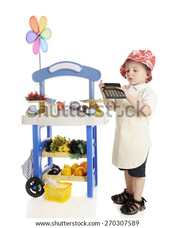An adorable preschooler standing by his fruit stand while calculating his profits to show the viewer.  The stand's signs are left blank for your text.  On a white background.