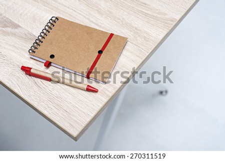 notebook on a white wooden table