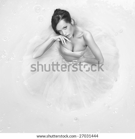 Fine art photo - beautiful girl standing in a big paint container - black white version