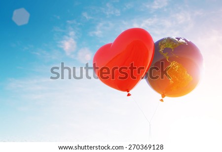 Heart and world Balloon fly to sky in light flare ,Earth Day Concept.Elements of this image furnished by NASA Royalty-Free Stock Photo #270369128