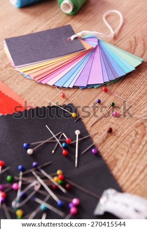 Samples of colorful fabric on wooden background