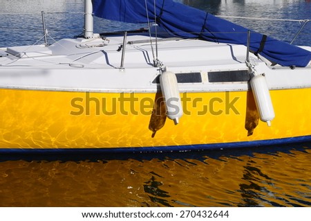 Graphic yellow and blue sail boat in france