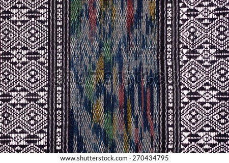 More than 100 years old colorful thai handcraft peruvian style rug surface old vintage torn conservation Made from natural materials Chemical free close up. Royalty-Free Stock Photo #270434795
