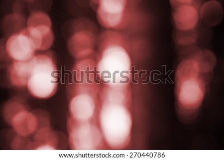 Out of focus lights in forest. defocused blurry bokeh background.