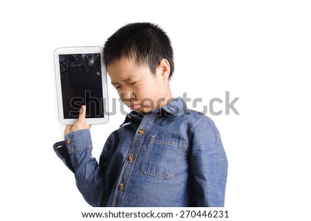Sad boy hold cracked tablet device on white background