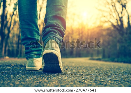 Woman jeans and sneaker shoes Royalty-Free Stock Photo #270477641