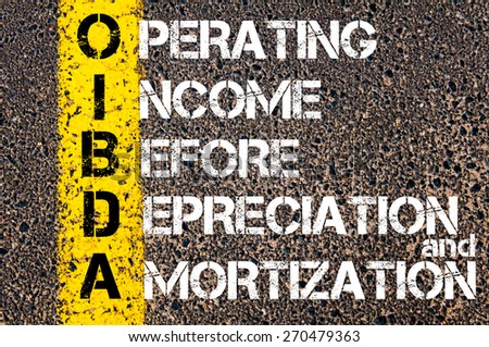 Business Acronym OIBDA - Operating Income Before Depreciation And Amortization. Yellow paint line on the road against asphalt background. Conceptual image
