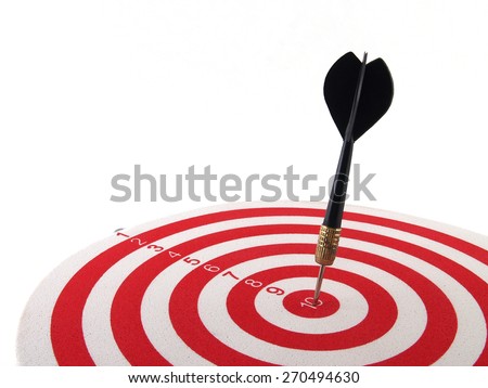 black dart arrow hitting on bullseye target center in red and white foam dartboard isolated on white background, aiming to achieve, perfection goal success, close-up with copy space Royalty-Free Stock Photo #270494630