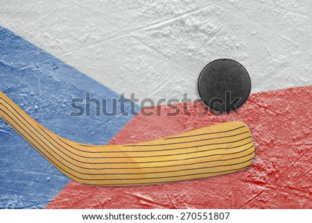 Hockey puck, hockey stick and the image of the Czech flag on the ice