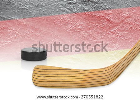 Stick, puck and hockey field with a German flag. The Concept