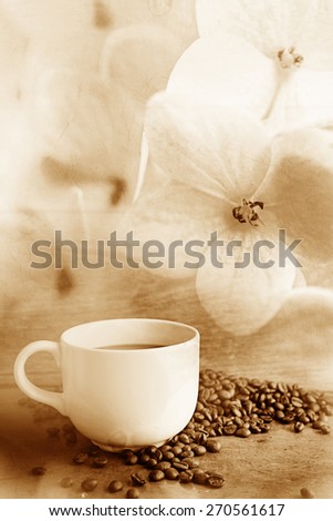 coffee with coffee beans wooden table and soft flower background