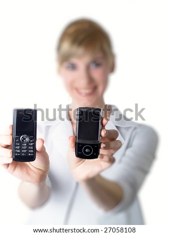 two mobile phones in hands at the girl