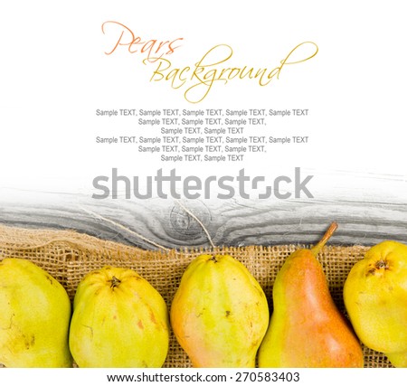 Photo of pears on burlap and wooden board with white space