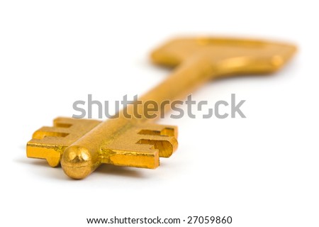 Macro of retro gold key isolated on white background