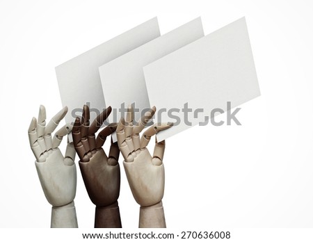 Wood hands of different colors holding blank pages