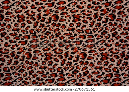 Red and black leopard pattern. Spotted fur animal print as background
