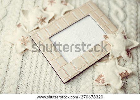 Close up picture of photography frame and decorative stars on artistic copy space background