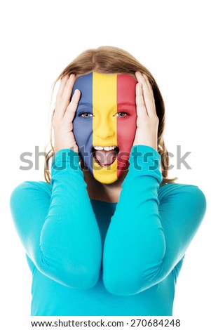 Woman with Romania flag painted on face.