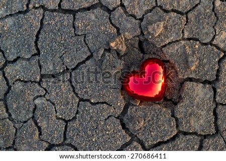 abstract red heart shape on crack ground nature sunset, soft focus