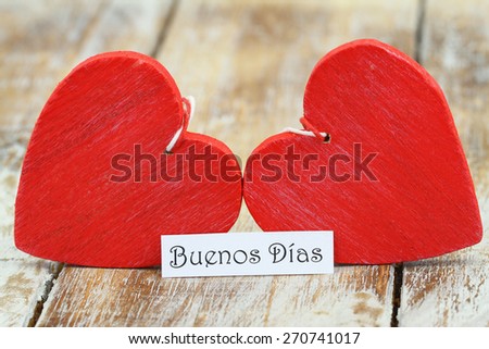 Buenos Dias (Good morning in Spanish) with two red wooden hearts 