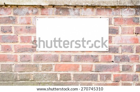 Blank Street sign on brick wall