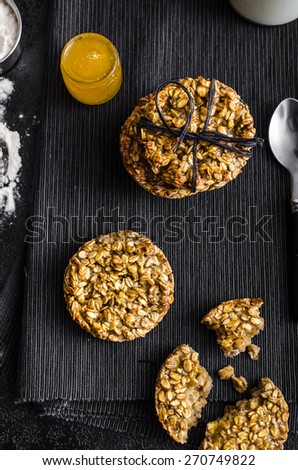 Banana cookies with flakes and honey, milk and ingredients on picture