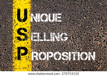 Business Acronym USP as Unique Selling Proposition. Yellow paint line on the road against asphalt background. Conceptual image