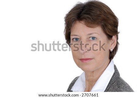 Portrait from a senior business woman. Picture was taken in a studio.