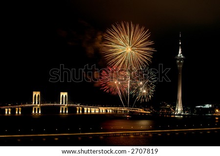 Celebration of New Year in Macau with fireworks beside the Tower Convention and Sai Van bridge