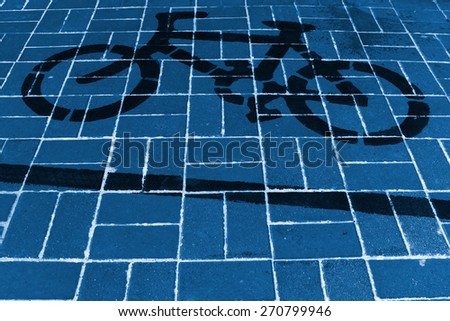 Bicycle sign painted on ground in a park, northern china