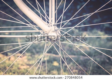 Detail of vintage bike wheel in retro color style