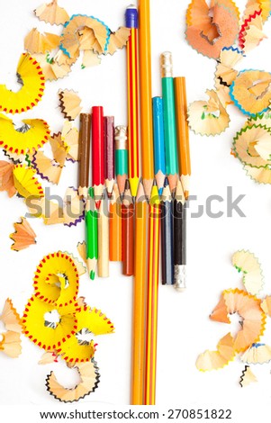 set of colored pencils to draw with the shavings on a white background