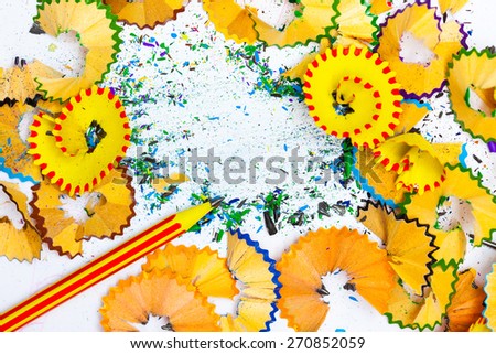 one striped pensil on the colored background withÃ?Â?Ã?Â  shavings