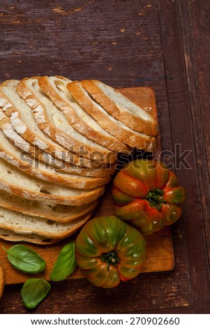 food still life. sliced fresh bread, tomato and olive oil