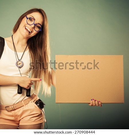 Travel and tourism active lifestyle concept. Woman tourist hitchhiking with blank sign for text filtered photo
