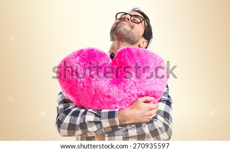 Posh boy holding a big heart