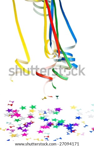 Curly ribbons and confetti on white background