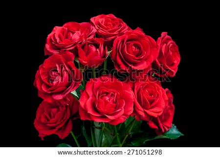 Bouquet of beautiful red roses on black. Floral background, artistic wallpaper, greeting card image