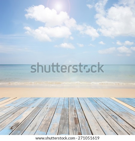 wooden floor with beautiful blue sky scenery for background.Wooden table on outdoor beach sea in the summer day seascape background.Texture of wood pier and sea background