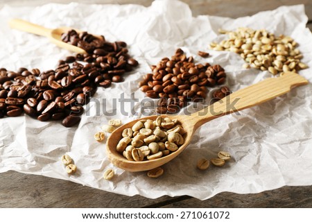 Coffee beans on crumpled parchment, closeup