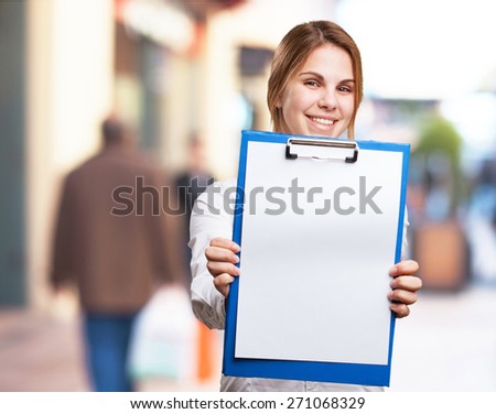 blond woman with paper and pen