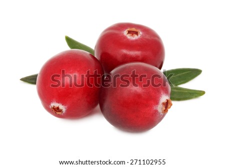 Three ripe cranberries with green leaves isolated on white background