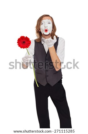 mime actor with a flower sends an air kiss