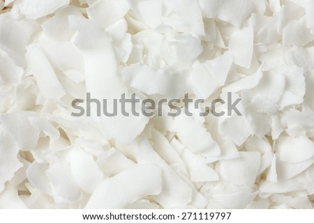 Detail of dried shaved coconut flakes. From above. Royalty-Free Stock Photo #271119797