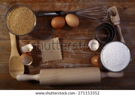Collection frame of ingredients and appliances for baking oatcakes on wooden table top copyspace, horizontal picture
