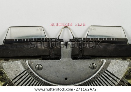 Business plan word printed on an old typewriter