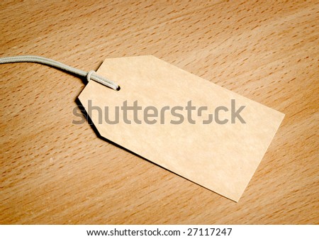 Blank tag on wooden background