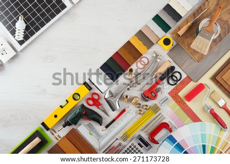Home renovation and do it yourself concept with home construction and repair tools on wooden surface, top view